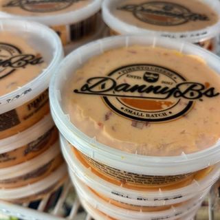 Danny B's tubs stacked in the store cooler
