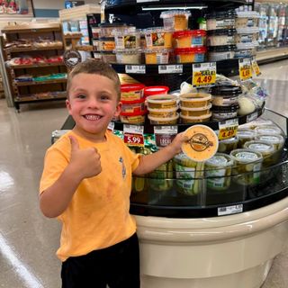 A young fan pointing out Danny B's on the shelf