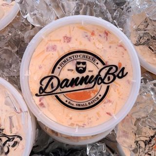 A tub of Danny B's Pimento Cheese on ice