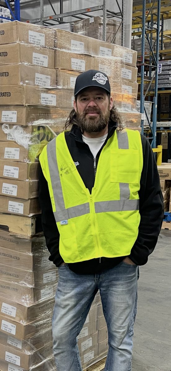 Danny B with pallets of pimento cheese at the warehouse